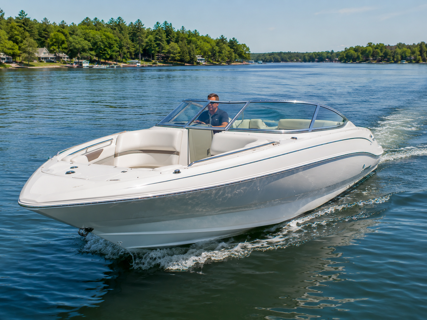 2008 Azure 298 bowrider cruising on calm lake water