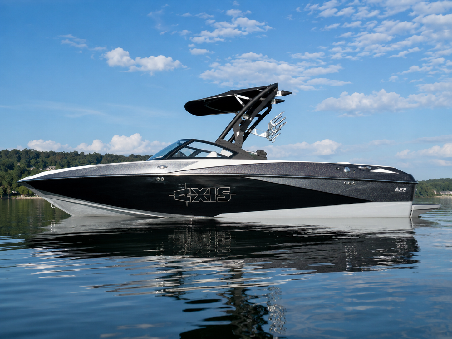 2009-2014 Axis A22 wake boat floating on calm lake water