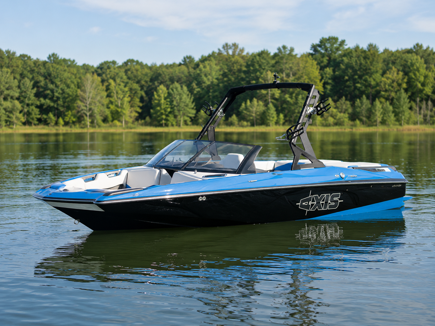 2011-2015 Axis A20 wake boat floating on calm lake water