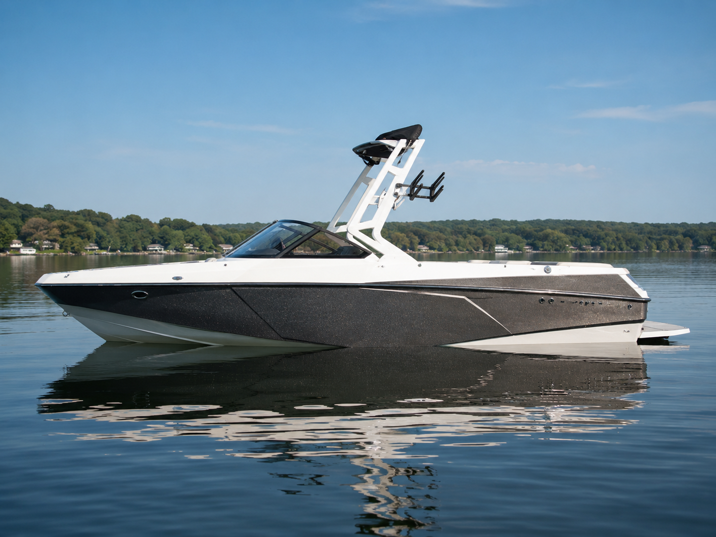 2014-2017 Axis T22 wake boat floating on calm lake water