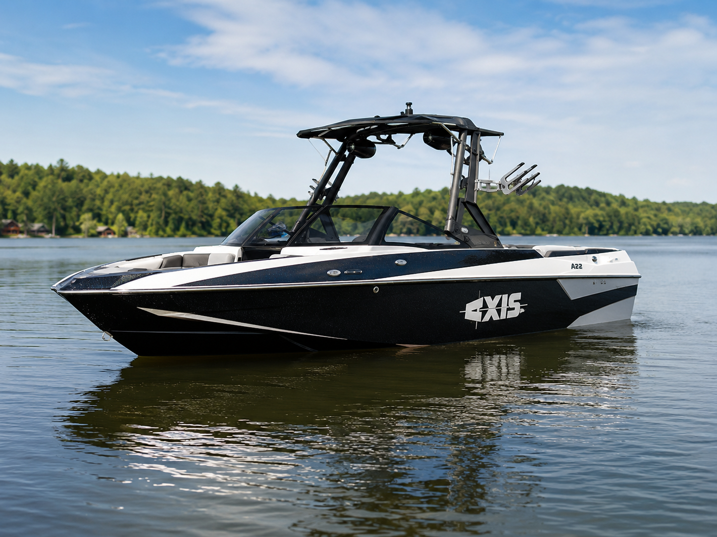 2015-2017 Axis A22 wake boat floating on calm lake water