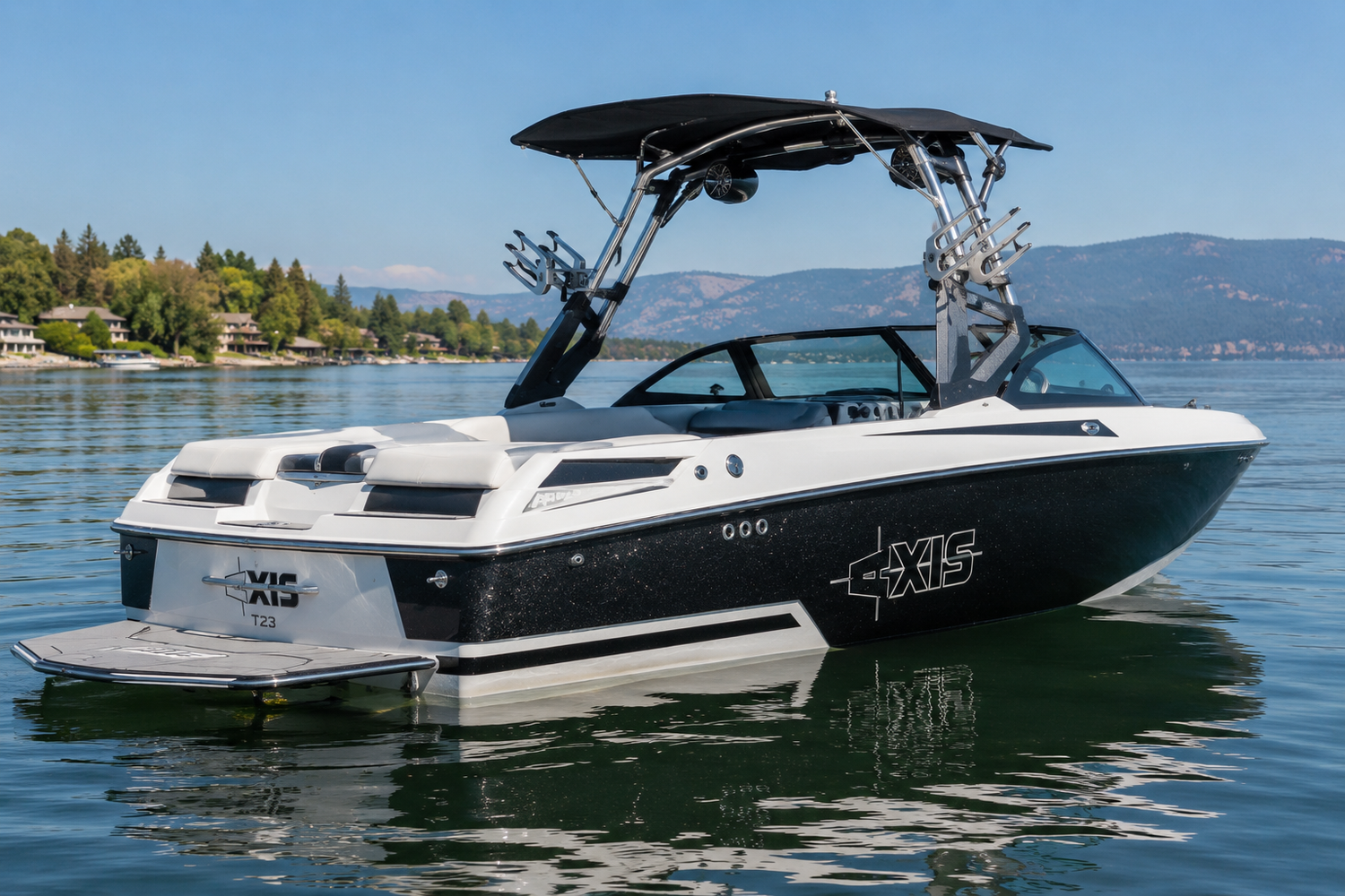 2015-2017 Axis T23 wake boat floating on calm lake water
