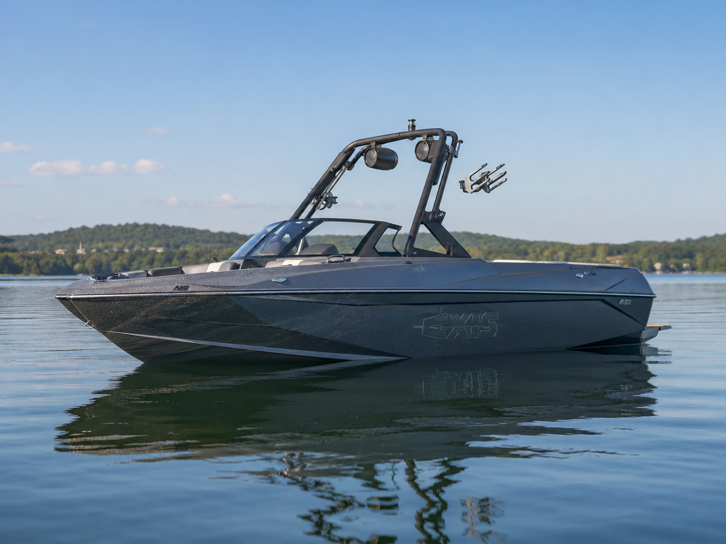 2016-2017 Axis A20 wake boat floating on calm lake water
