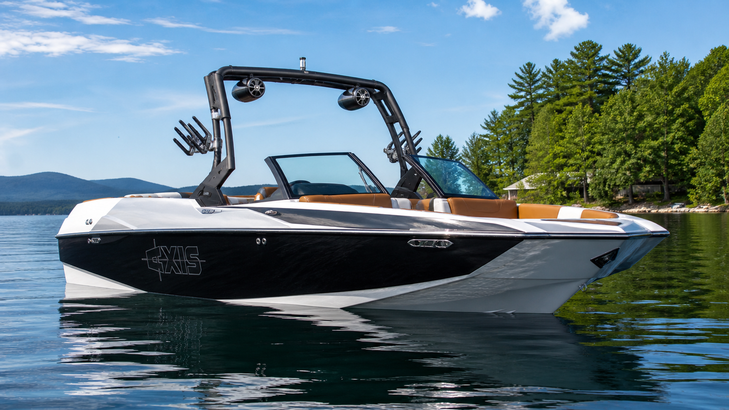 2018-2020 Axis A24 wakesurf boat floating on calm lake water