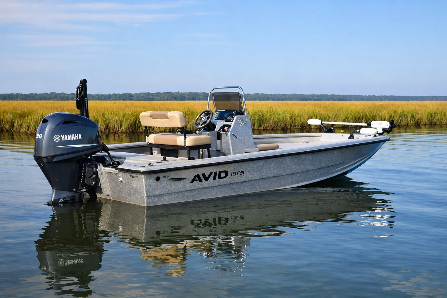 2023 Avid 19FS bay boat floating in calm inshore water near marsh grass