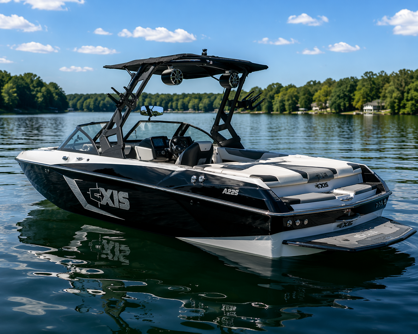 2023 Axis A225 wakesurf boat floating on calm lake water