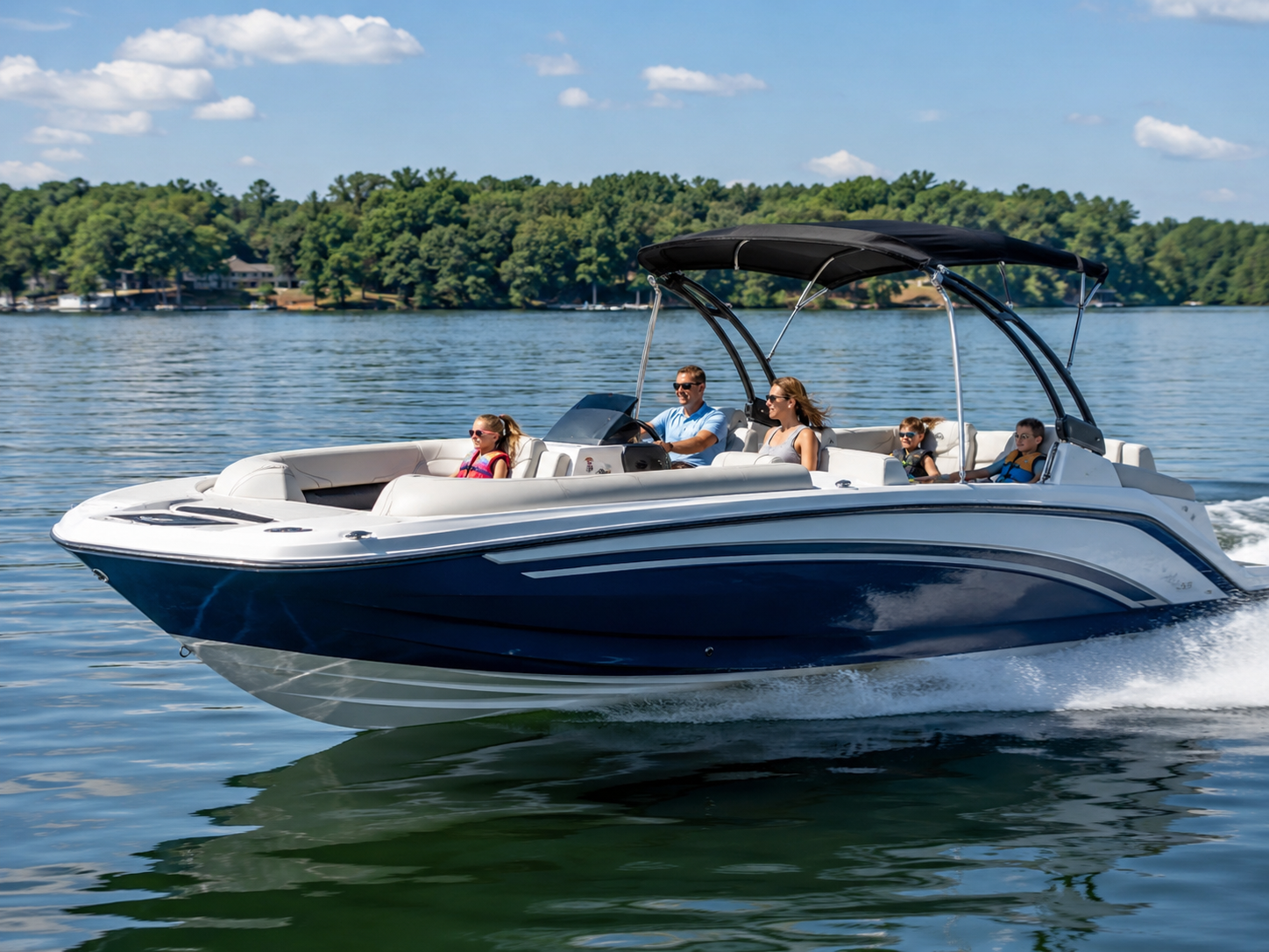Azure 240 deck boat cruising on calm lake water